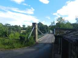 Second view of Whorlton Suspension Bridge and toll house from far end of bridge July 2016
